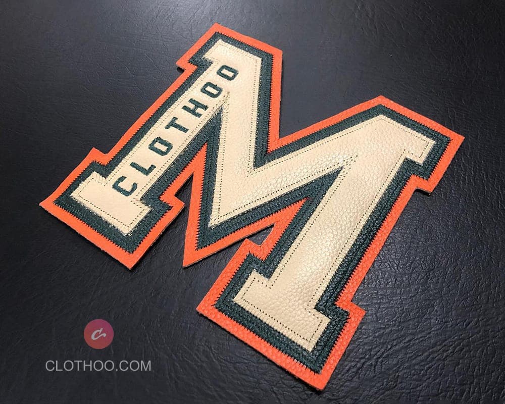 Leather letter patch on varsity jacket